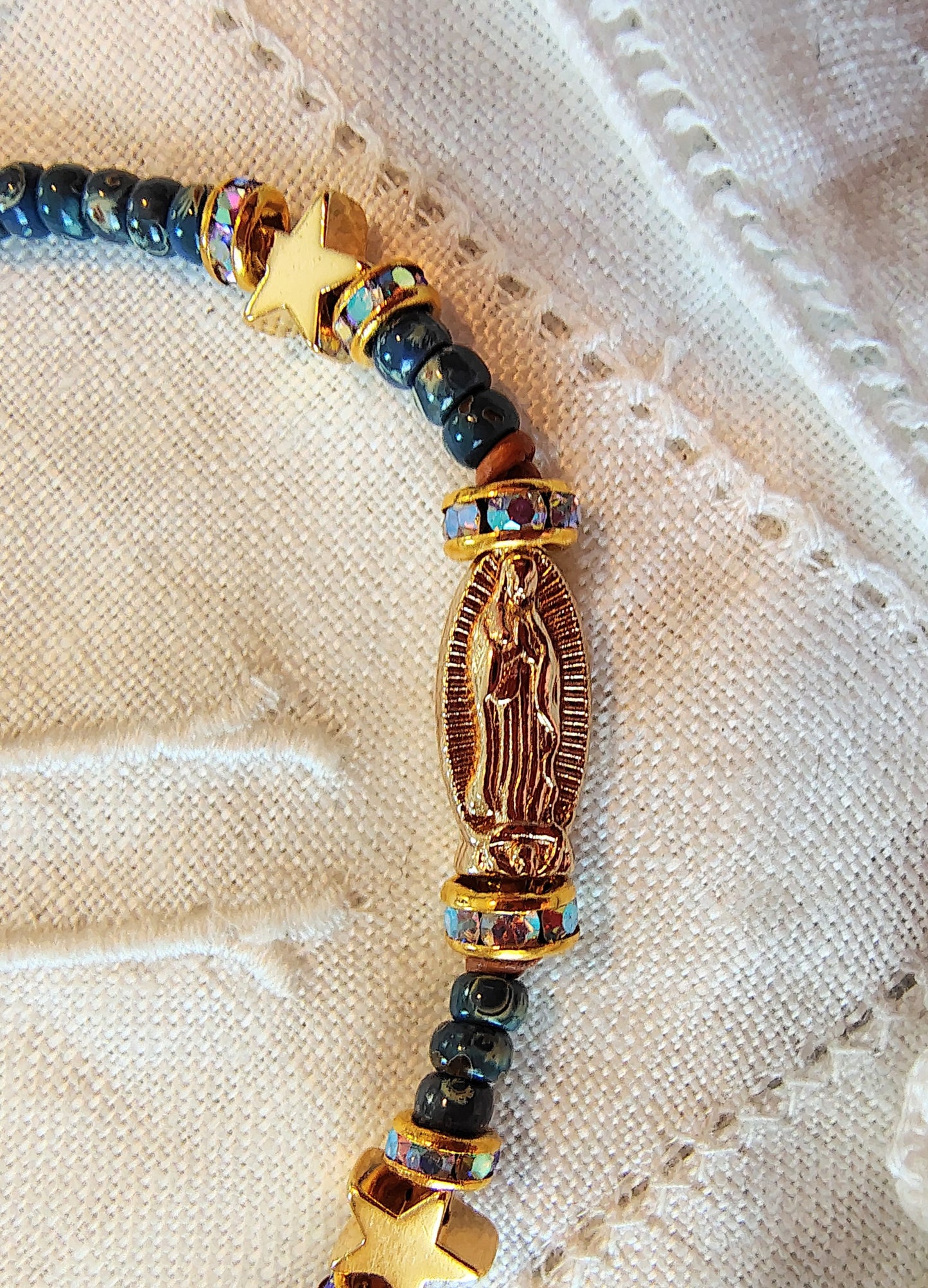 Our Lady of Guadalupe adjustable handmade bracelet with Cobalt blue or teal Miyuki Picasso beads and aaa Crystal rondeles, .5mm leather cord