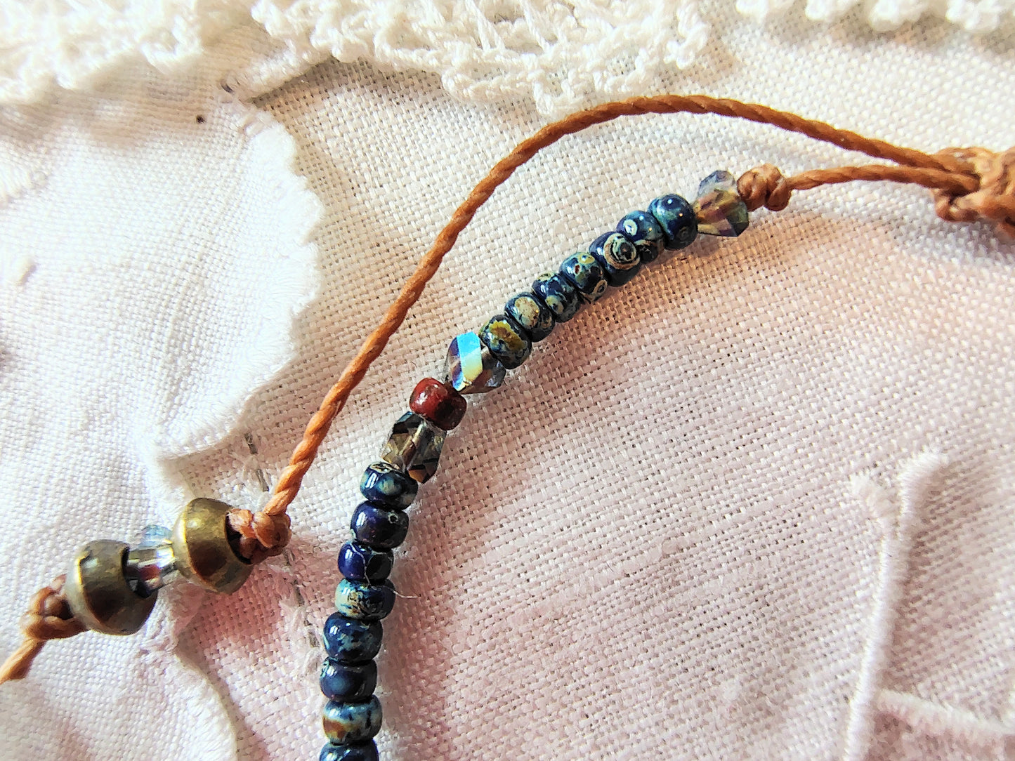 Miraculous Medal adjustable handmade bracelet with Cobalt blue Miyuki beads, red opaque Picasso Beads and Multi-colored pyramid beads