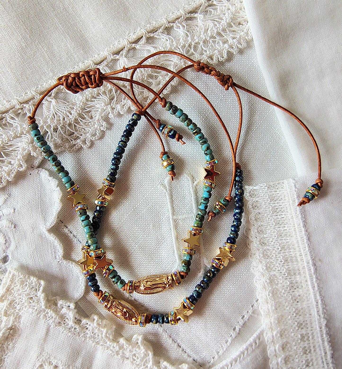 Our Lady of Guadalupe adjustable handmade bracelet with Cobalt blue or teal Miyuki Picasso beads and aaa Crystal rondeles, .5mm leather cord