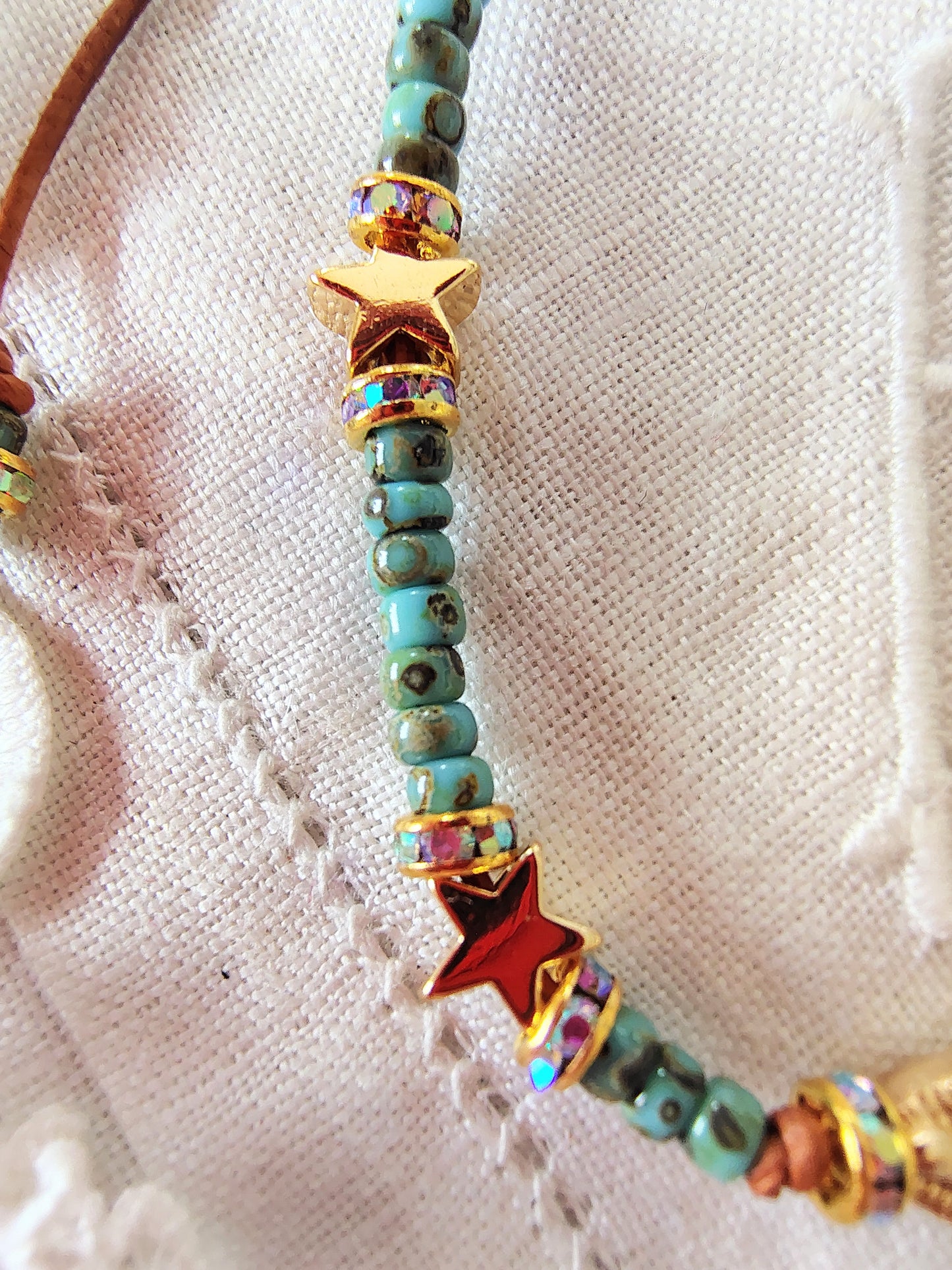 Our Lady of Guadalupe adjustable handmade bracelet with Cobalt blue or teal Miyuki Picasso beads and aaa Crystal rondeles, .5mm leather cord