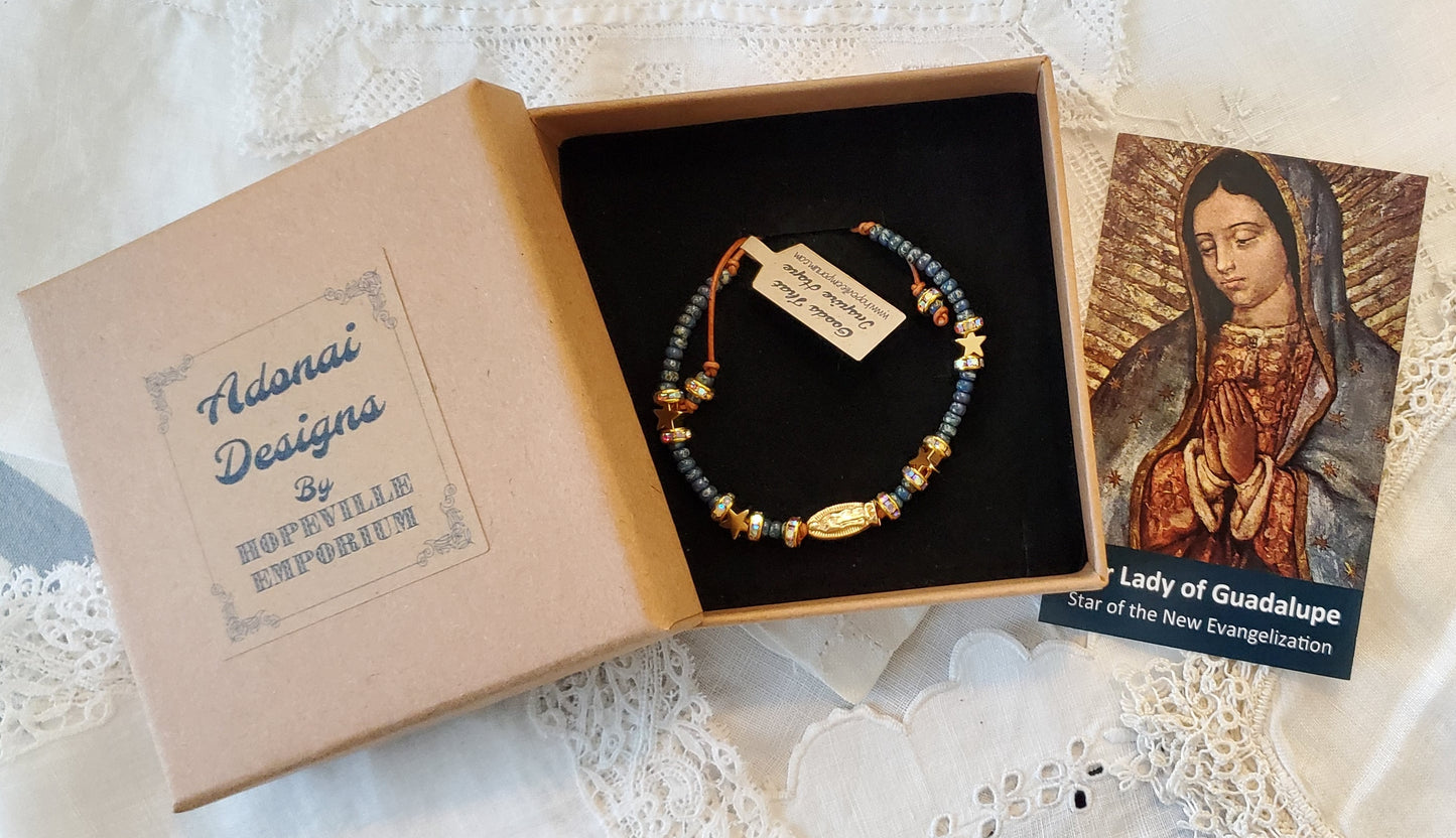 Our Lady of Guadalupe adjustable handmade bracelet with Cobalt blue or teal Miyuki Picasso beads and aaa Crystal rondeles, .5mm leather cord