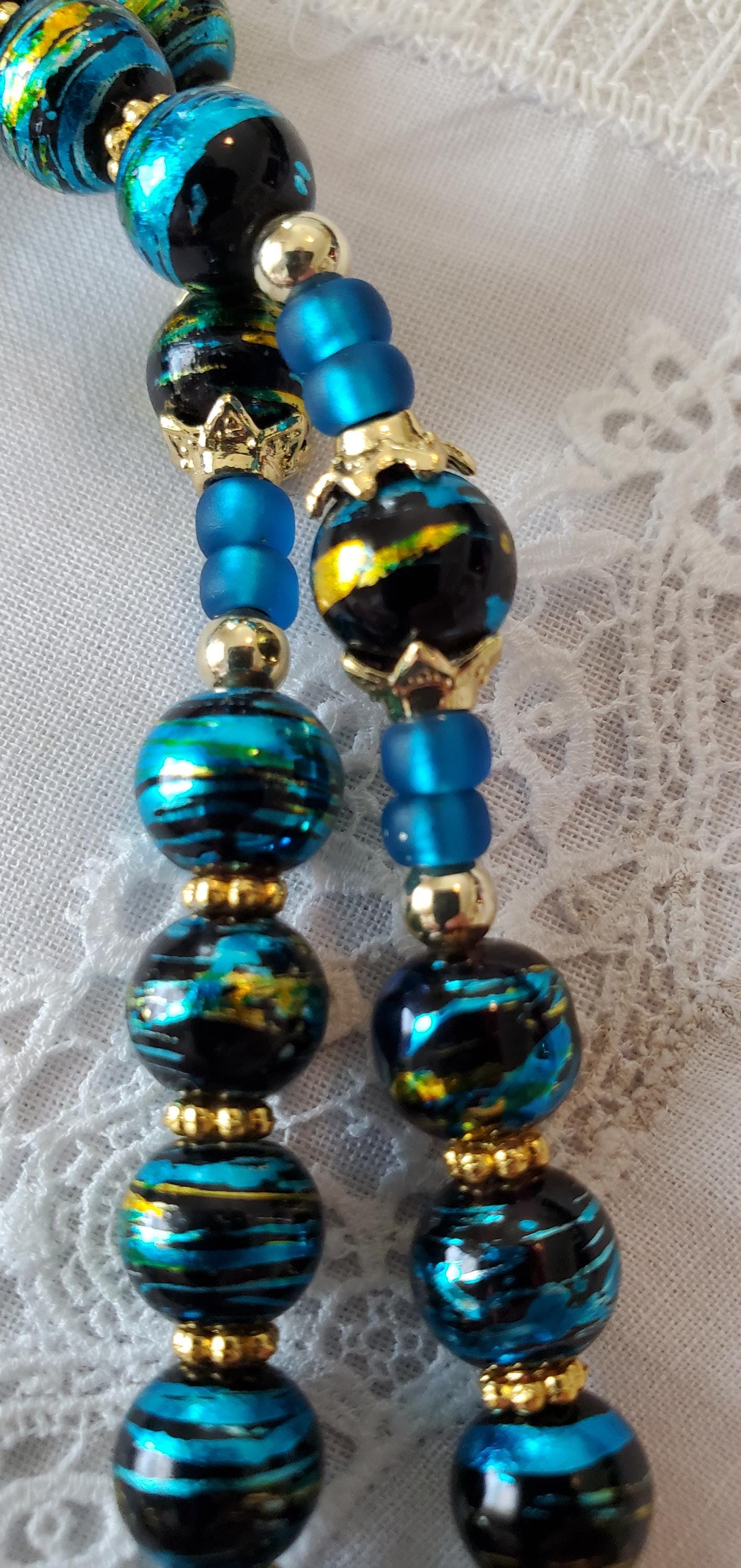 Hand-Knotted Rosary Imported Italian Gold Crucifix, Shroud of Turin Centerpiece Draw bench metallic glass black rosary cord prayer card