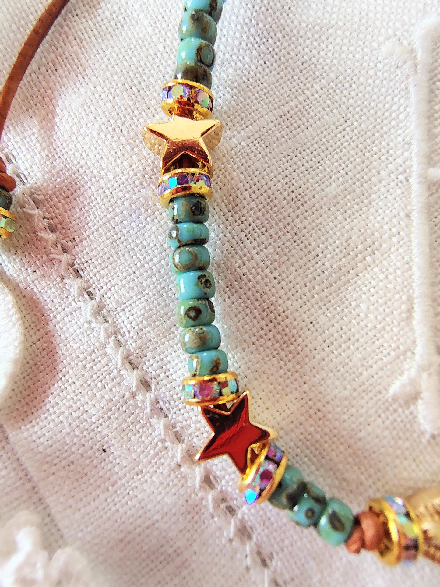 Our Lady of Guadalupe Bracelet: Miyuki Picasso Beads, AAA Crystal Rondelles leather Cord star shaped Gold tone beads sacred bead numbers.