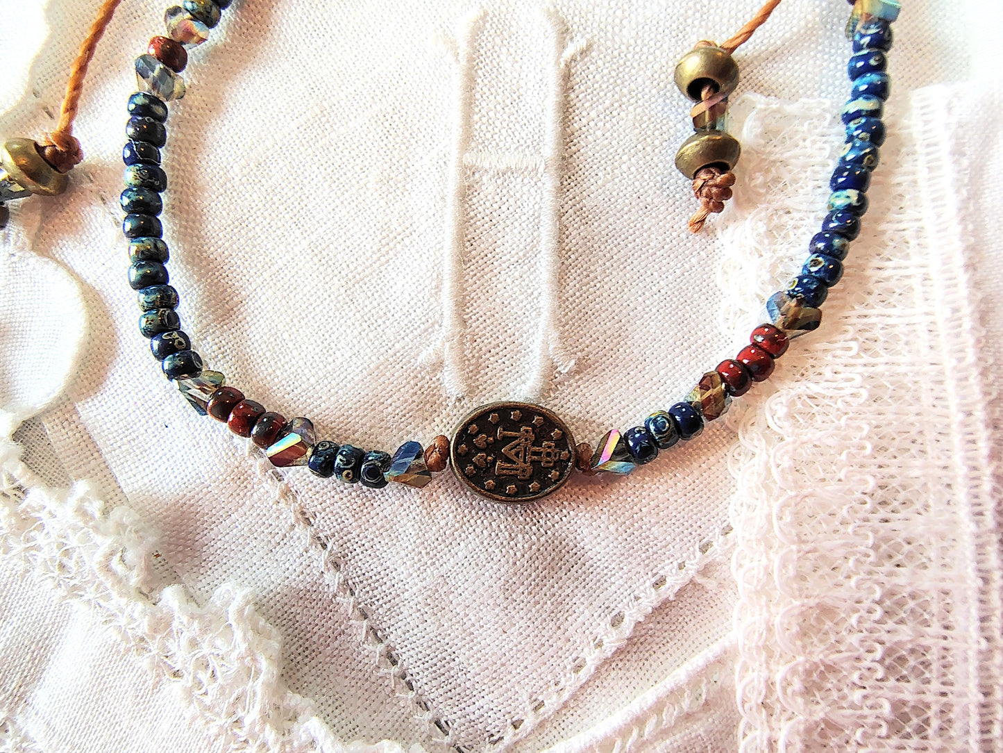 Miraculous Medal adjustable handmade bracelet with Cobalt blue Miyuki beads, red opaque Picasso Beads and Multi-colored pyramid beads