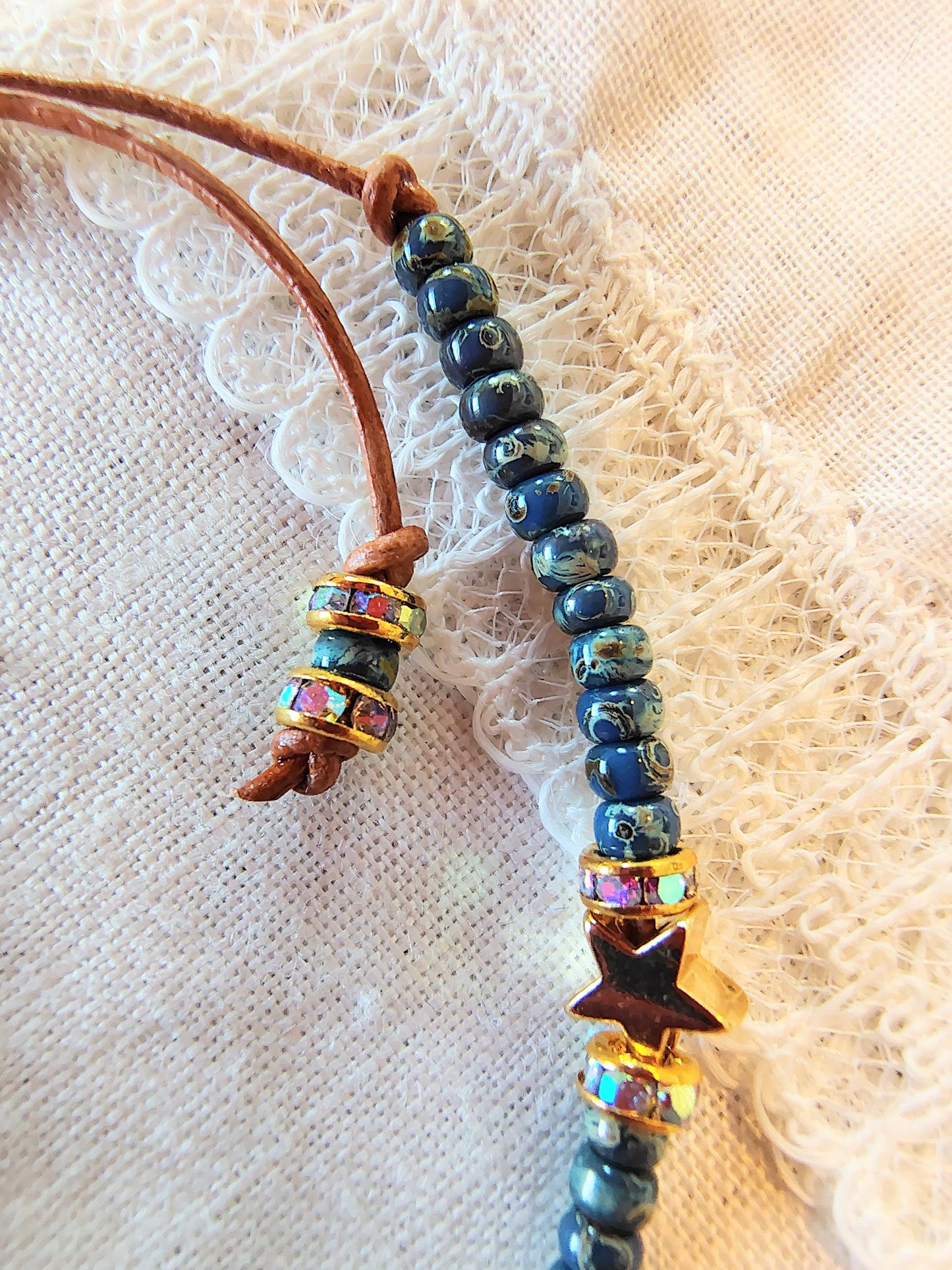 Our Lady of Guadalupe adjustable handmade bracelet with Cobalt blue or teal Miyuki Picasso beads and aaa Crystal rondeles, .5mm leather cord