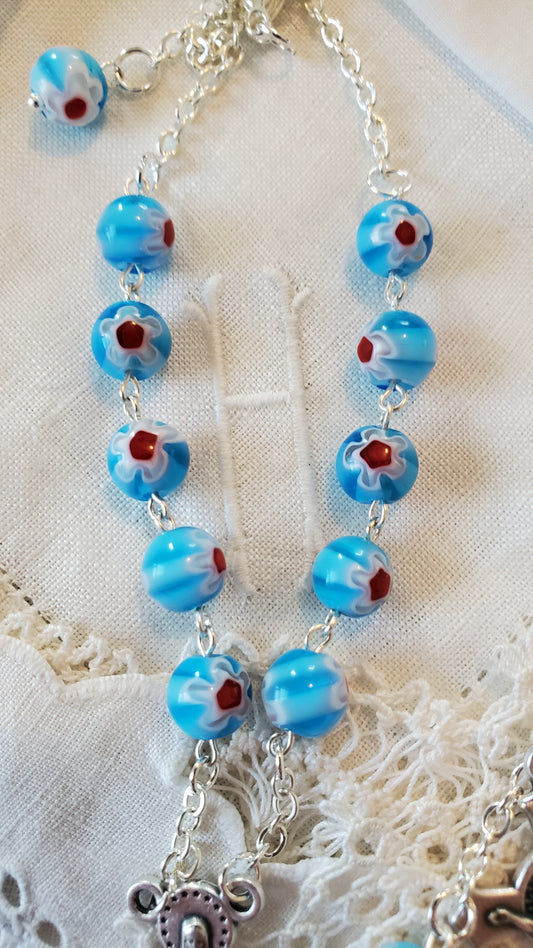 Handmade light blue, white and red floral millifiori linked car rosary